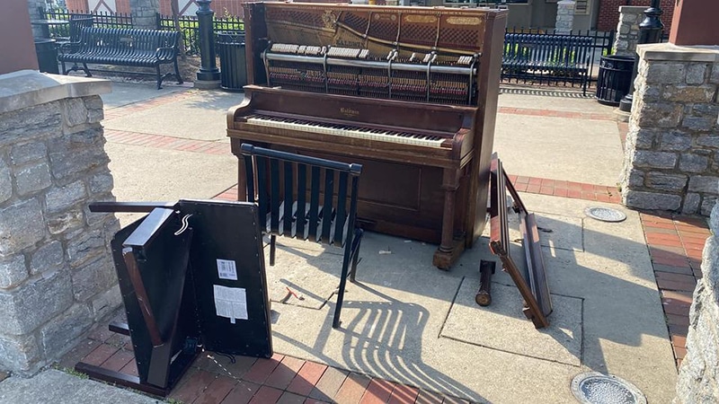 damaged piano outside