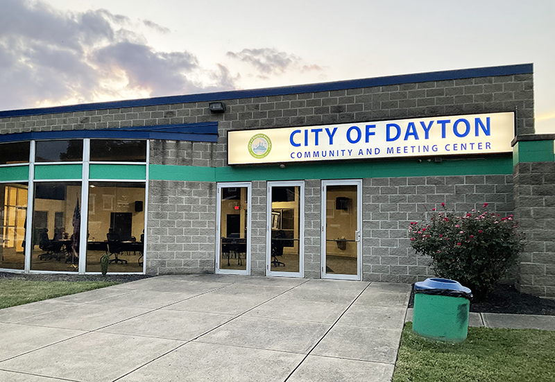 Building with large windows and a sign above the door, "City of Dayton."